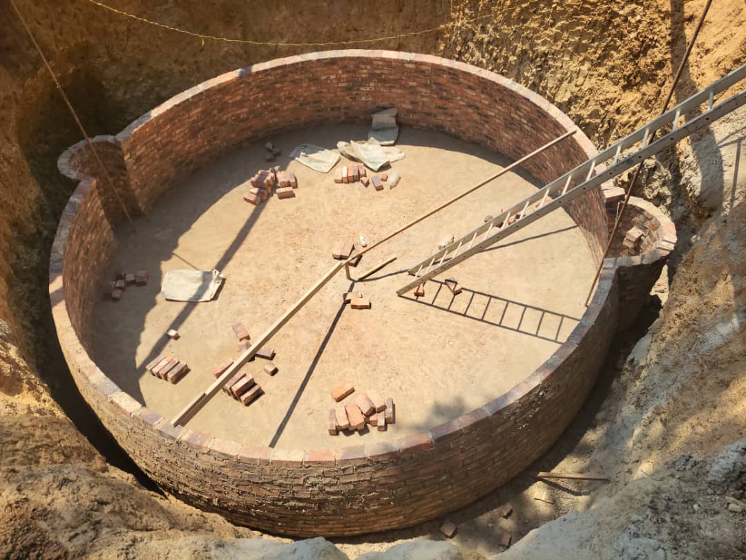 Biogas digester brick base under construction